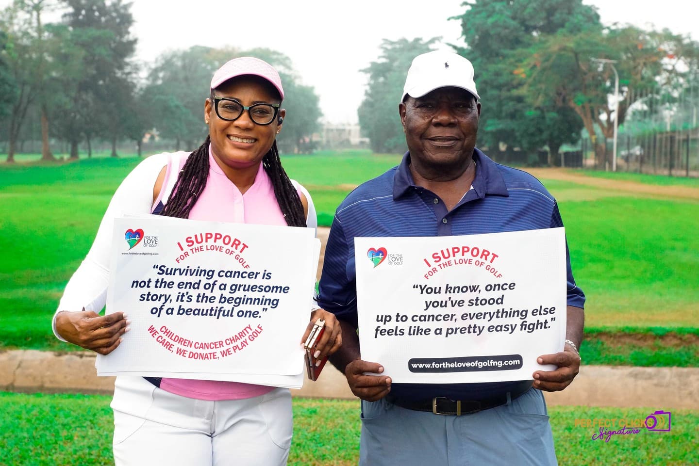 Two golfers holding messages of hope in support of childhood cancer awareness